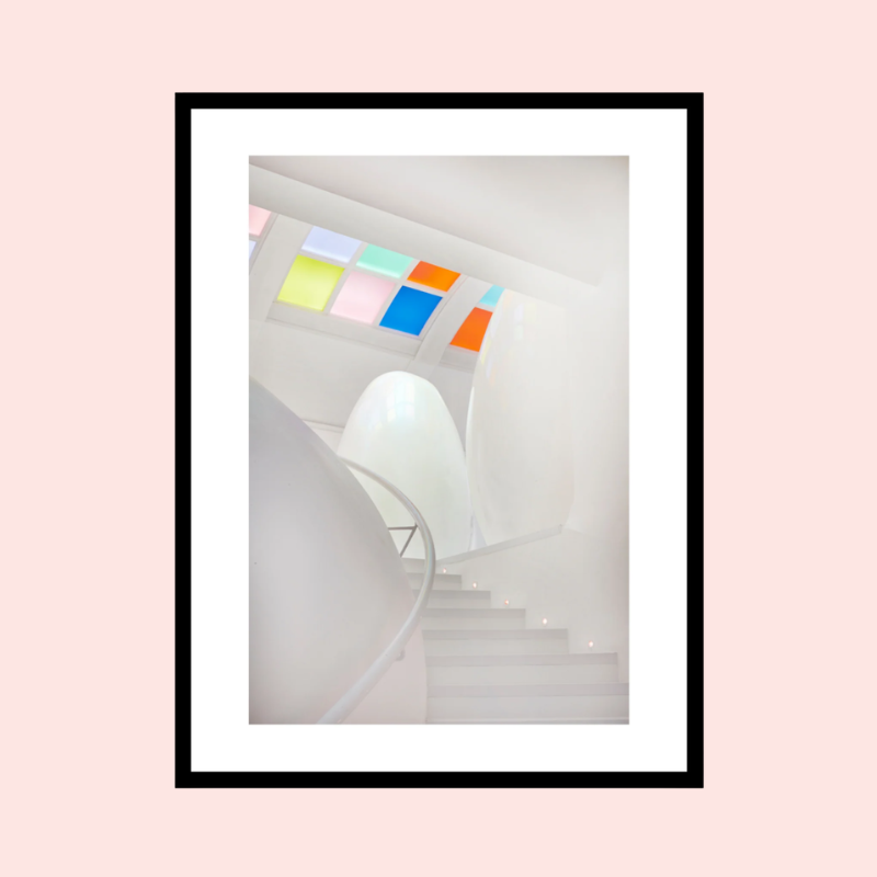 Load image into Gallery viewer, Framed photograph of a modern interior with colorful windows and a white pod on a pink background