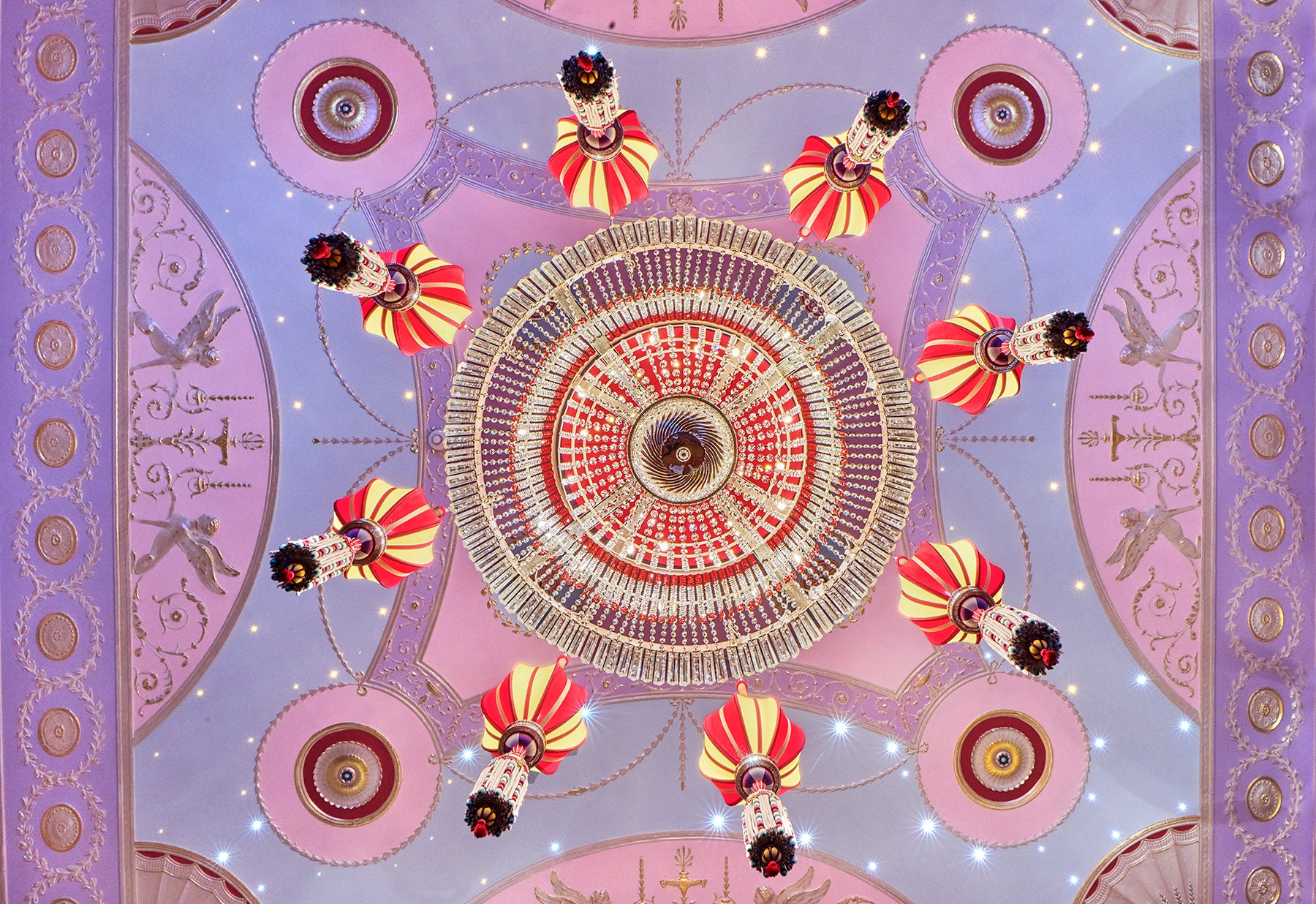 Load image into Gallery viewer, Decorative design with circular patterns and colorful elements on a purple background