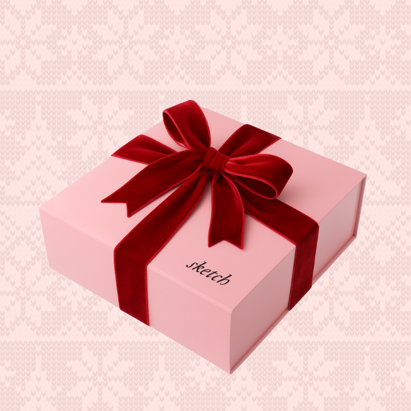 Load image into Gallery viewer, Pink gift box with a red ribbon on a pink textured background