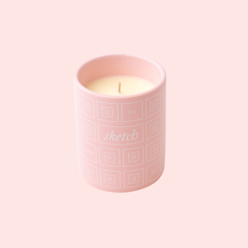 Load image into Gallery viewer, Pink candle with 'sketch' branding on a light pink background