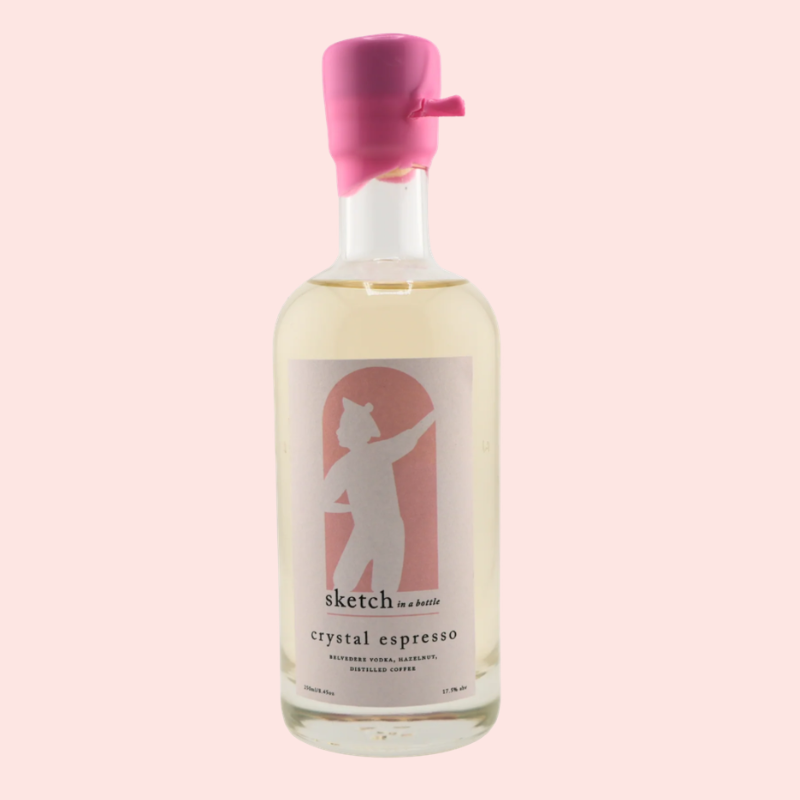 Load image into Gallery viewer, Bottle of 'crystal espresso' with a pink cap on a light pink background
